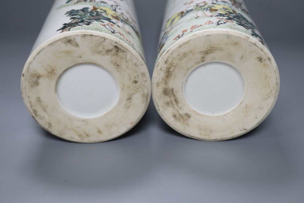 A pair of Chinese cylindrical porcelain vases, enamelled with fisherfolk, 29cm